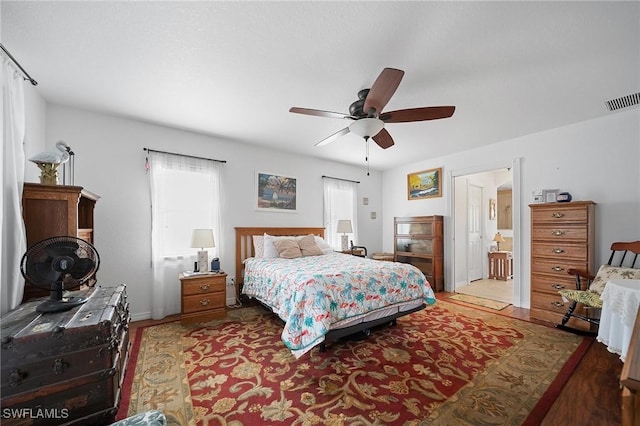 134 Dartmouth Dr NW, Port Charlotte, FL 33952 - bedroom with a ceiling fan and wood finished floors