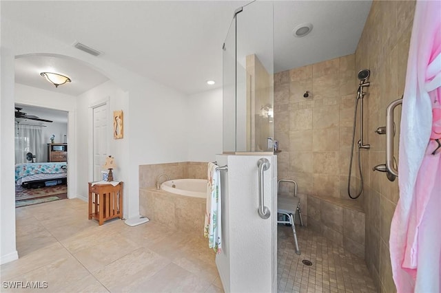 134 Dartmouth Dr NW, Port Charlotte, FL 33952 - full bath with ensuite bath, a bath, tiled shower, and tile patterned flooring