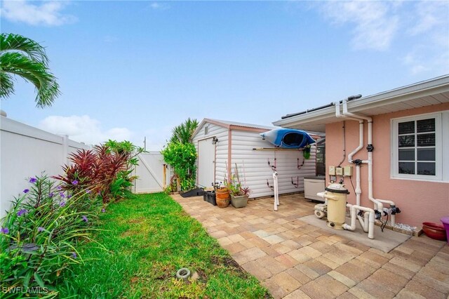 134 Dartmouth Dr NW, Port Charlotte, FL 33952 - fenced backyard featuring a patio area