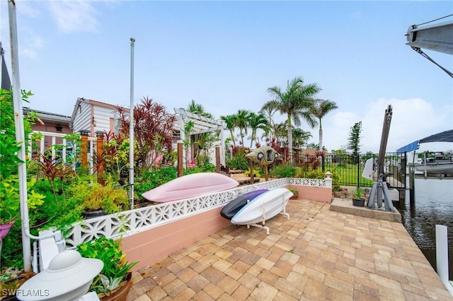 134 Dartmouth Dr NW, Port Charlotte, FL 33952 - view of patio with boat lift, a dock, and a pergola