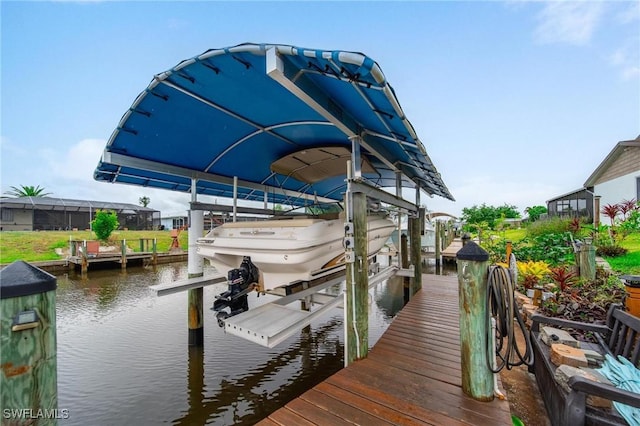 134 Dartmouth Dr NW, Port Charlotte, FL 33952 - dock with boat lift and a water view