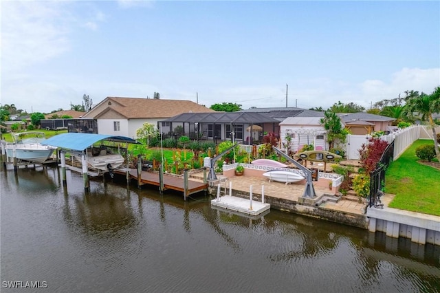 134 Dartmouth Dr NW, Port Charlotte, FL 33952 - dock area featuring boat lift, a water view, and a residential view
