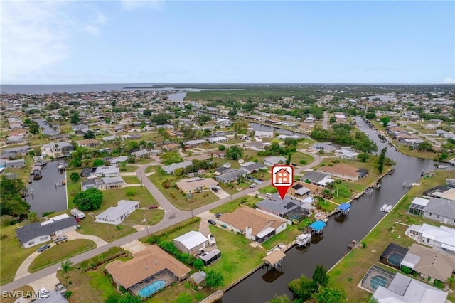 134 Dartmouth Dr NW, Port Charlotte, FL 33952 - aerial view of property and surrounding area with nearby suburban area and a large body of water