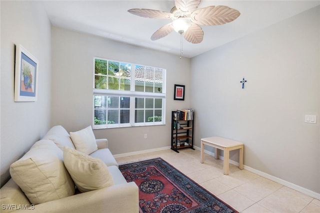 20101 Seagrove St Unit 702, Estero, FL 33928 - living area with ceiling fan, light tile patterned floors, and baseboards