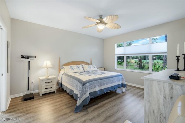 20101 Seagrove St Unit 702, Estero, FL 33928 - bedroom featuring wood finished floors, baseboards, and ceiling fan