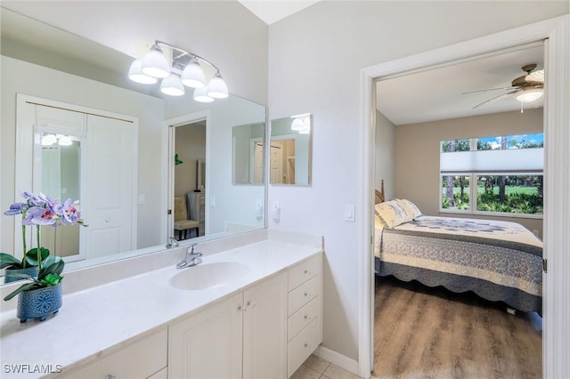20101 Seagrove St Unit 702, Estero, FL 33928 - bathroom featuring ensuite bathroom, vanity, baseboards, and a ceiling fan