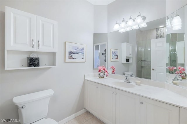 20101 Seagrove St Unit 702, Estero, FL 33928 - bathroom with toilet, an enclosed shower, baseboards, tile patterned floors, and vanity