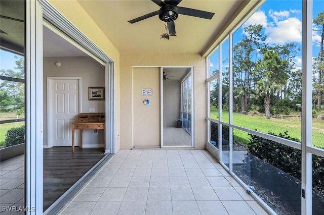 20101 Seagrove St Unit 702, Estero, FL 33928 - unfurnished sunroom with ceiling fan and plenty of natural light