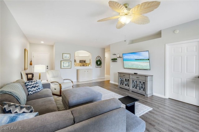20101 Seagrove St Unit 702, Estero, FL 33928 - living room featuring arched walkways, wood finished floors, baseboards, ceiling fan, and recessed lighting