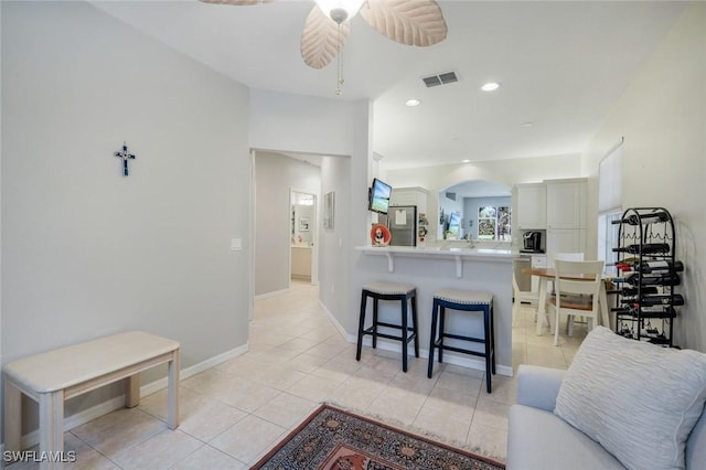 20101 Seagrove St Unit 702, Estero, FL 33928 - living area with arched walkways, light tile patterned floors, ceiling fan, and recessed lighting