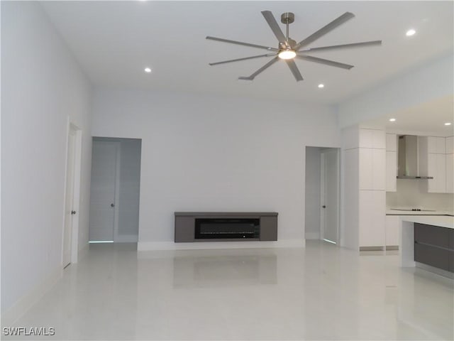 3813 16th Ave NE, Naples, FL 34120 - unfurnished living room with recessed lighting, baseboards, and ceiling fan
