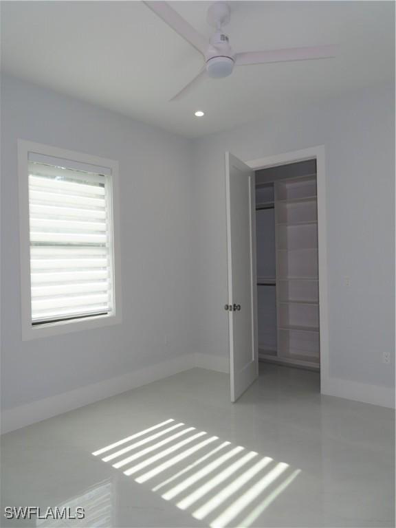 3813 16th Ave NE, Naples, FL 34120 - unfurnished bedroom featuring baseboards, recessed lighting, and a ceiling fan
