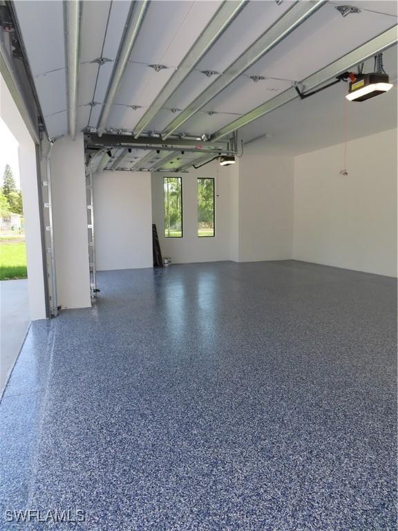 3813 16th Ave NE, Naples, FL 34120 - garage with a garage door opener