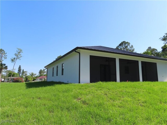 3813 16th Ave NE, Naples, FL 34120 - view of home's exterior with stucco siding