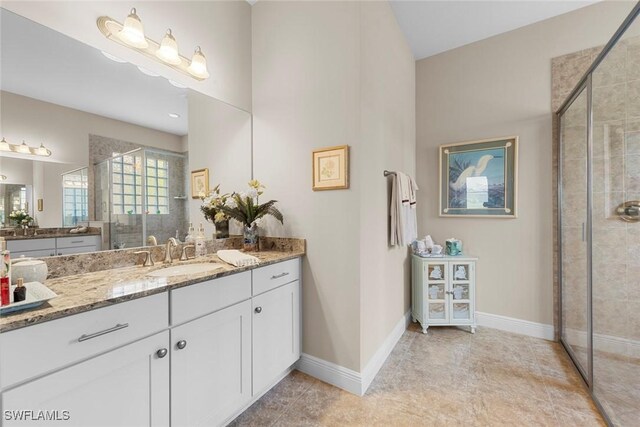 10450 Materita Dr, Fort Myers, FL 33913 - bathroom with a stall shower, baseboards, vanity, and tile patterned flooring