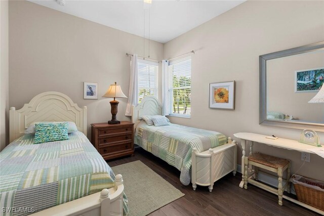 10450 Materita Dr, Fort Myers, FL 33913 - bedroom featuring dark wood finished floors and baseboards