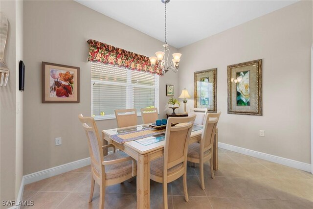 10450 Materita Dr, Fort Myers, FL 33913 - dining room featuring a chandelier, light tile patterned floors, and baseboards