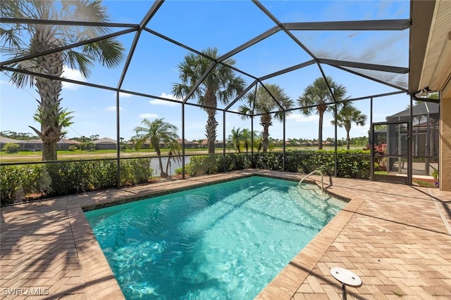 10450 Materita Dr, Fort Myers, FL 33913 - swimming pool with a patio area, a lanai, and a water view