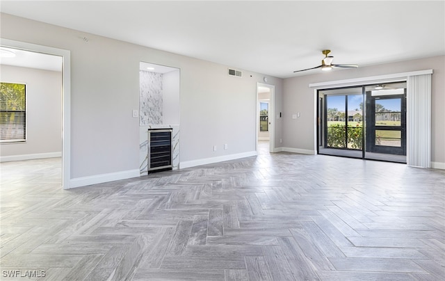 16320 Kelly Cove Dr Unit 267, Fort Myers, FL 33908 - spare room with wine cooler, baseboards, and a ceiling fan