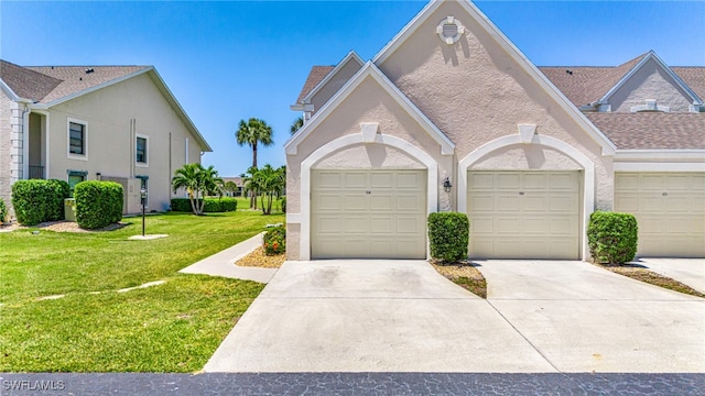 16320 Kelly Cove Dr Unit 267, Fort Myers, FL 33908 - view of front of home with a front yard, stucco siding, and concrete driveway