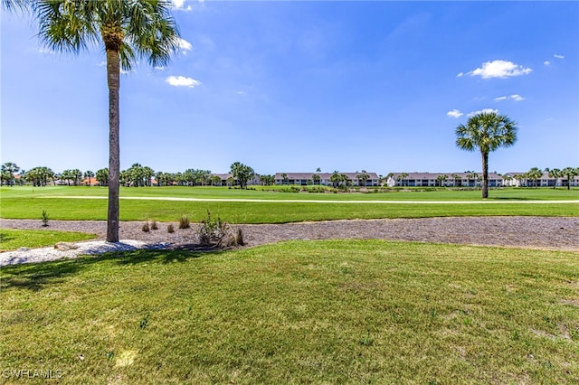 16320 Kelly Cove Dr Unit 267, Fort Myers, FL 33908 - view of community featuring a yard, view of golf course, and a residential view