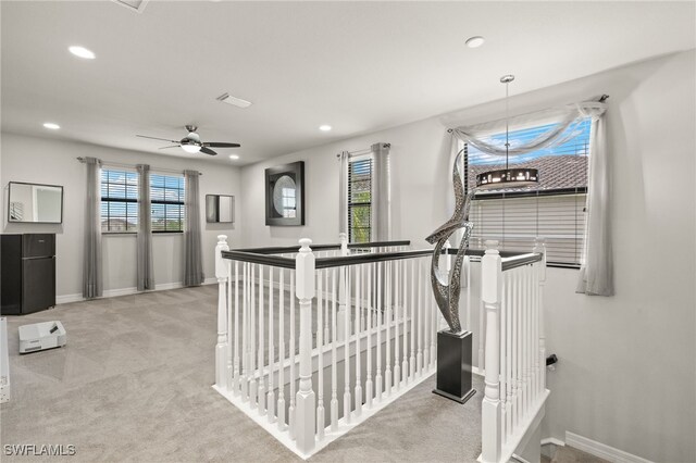 4172 Crescent Ct, Naples, FL 34119 - hall featuring an upstairs landing, carpet floors, healthy amount of natural light, recessed lighting, and baseboards