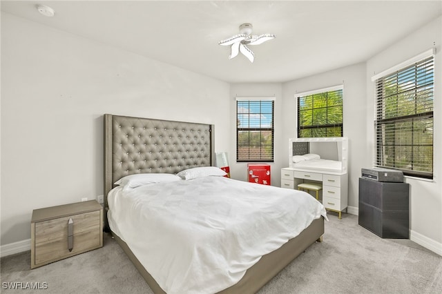4172 Crescent Ct, Naples, FL 34119 - bedroom with light colored carpet, multiple windows, and baseboards