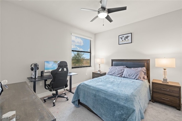 4172 Crescent Ct, Naples, FL 34119 - bedroom featuring light carpet, a desk, a ceiling fan, and baseboards