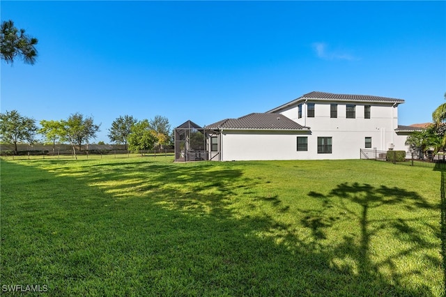 4172 Crescent Ct, Naples, FL 34119 - rear view of property with stucco siding and a lanai