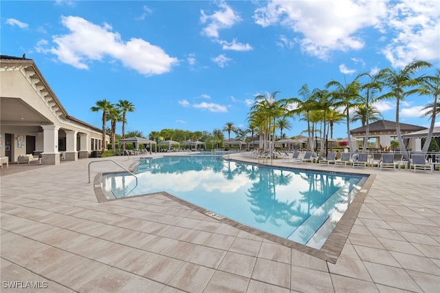 4172 Crescent Ct, Naples, FL 34119 - community pool with a patio