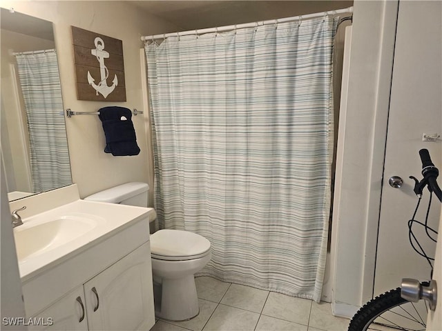 7330 Estero Blvd Unit 601, Fort Myers Beach, FL 33931 - bathroom with tile patterned flooring, toilet, vanity, and curtained shower