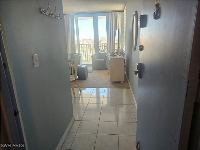 7330 Estero Blvd Unit 601, Fort Myers Beach, FL 33931 - hallway with baseboards and light tile patterned floors