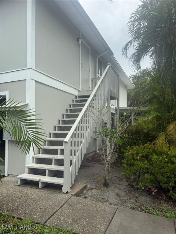 view of side of property with stairway