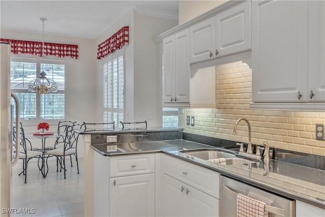 8032 Kilkenny Way Unit G33, Naples, FL 34112 - kitchen featuring a sink, stainless steel dishwasher, white cabinets, backsplash, and crown molding