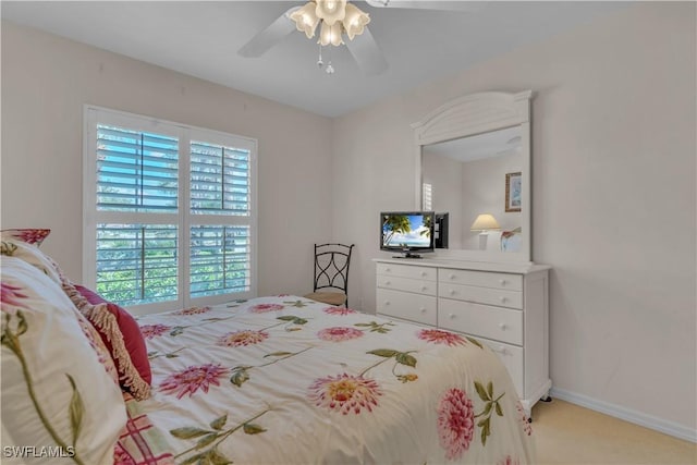 8032 Kilkenny Way Unit G33, Naples, FL 34112 - bedroom with ceiling fan, light carpet, and baseboards