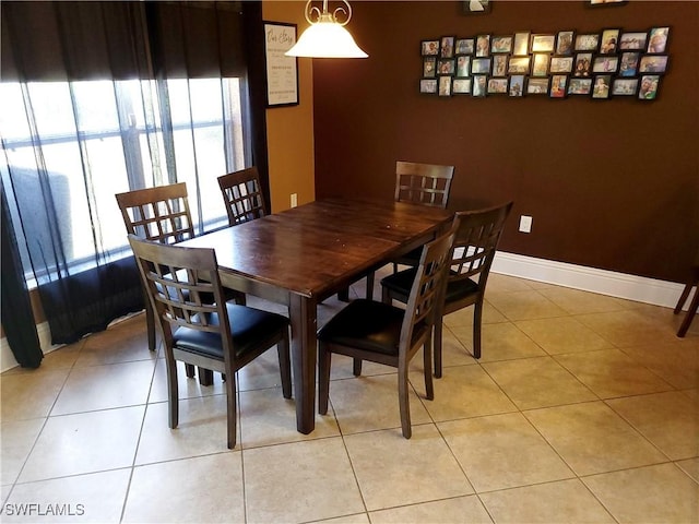 506 Desoto Ave, Lehigh Acres, FL 33972 - dining area featuring plenty of natural light, baseboards, and light tile patterned floors