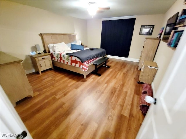506 Desoto Ave, Lehigh Acres, FL 33972 - bedroom with light wood finished floors, baseboards, and a ceiling fan