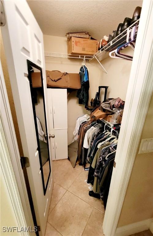506 Desoto Ave, Lehigh Acres, FL 33972 - spacious closet featuring light tile patterned flooring