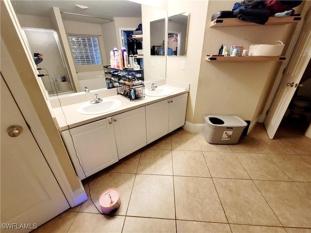 506 Desoto Ave, Lehigh Acres, FL 33972 - bathroom featuring a shower stall, double vanity, tile patterned flooring, and a bathtub