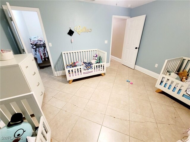 506 Desoto Ave, Lehigh Acres, FL 33972 - bedroom featuring light tile patterned floors and baseboards