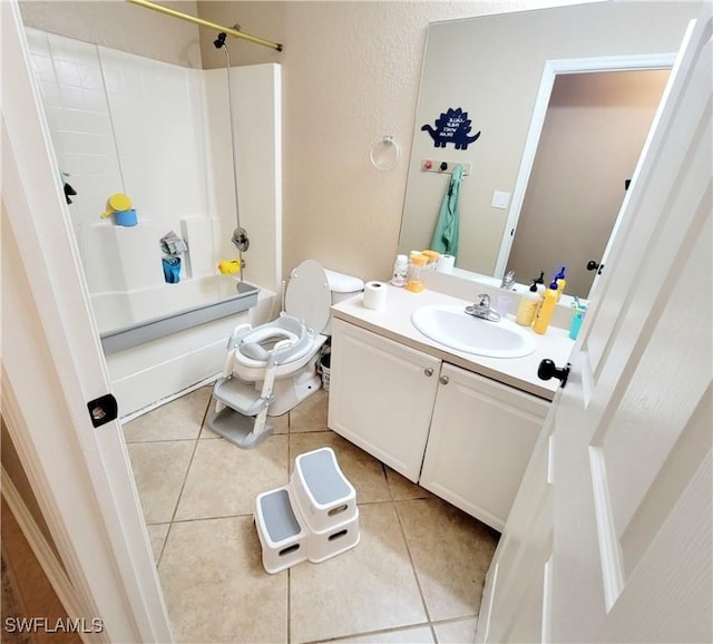 506 Desoto Ave, Lehigh Acres, FL 33972 - full bathroom with vanity, shower / tub combination, tile patterned flooring, and toilet