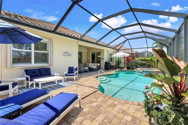 9578 Coquina Cir, Naples, FL 34120 - view of swimming pool with an outdoor living space, a patio area, a pool with connected hot tub, and glass enclosure