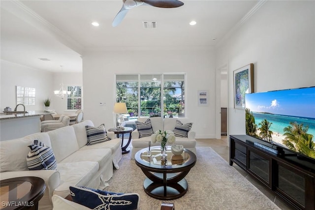 9578 Coquina Cir, Naples, FL 34120 - living area with crown molding, a chandelier, ceiling fan, recessed lighting, and baseboards