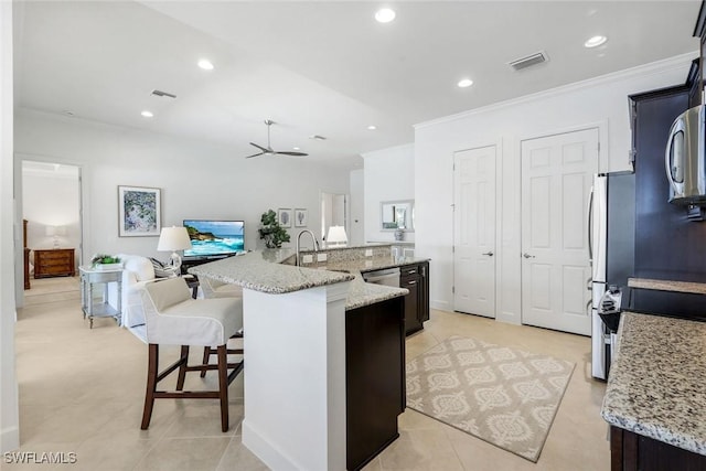 9578 Coquina Cir, Naples, FL 34120 - kitchen featuring ornamental molding, a sink, recessed lighting, a large island, and open floor plan