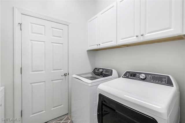 9578 Coquina Cir, Naples, FL 34120 - laundry room with washing machine and dryer and cabinet space