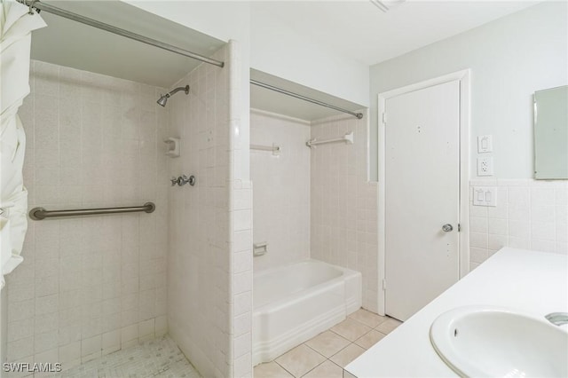 4330 S Canal Cir, North Fort Myers, FL 33903 - full bathroom with tile walls, tile patterned floors, a wainscoted wall, and vanity