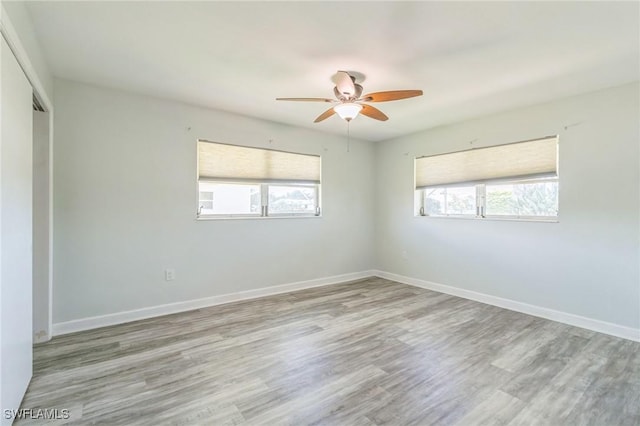 4330 S Canal Cir, North Fort Myers, FL 33903 - unfurnished room featuring ceiling fan, light wood-style floors, and baseboards