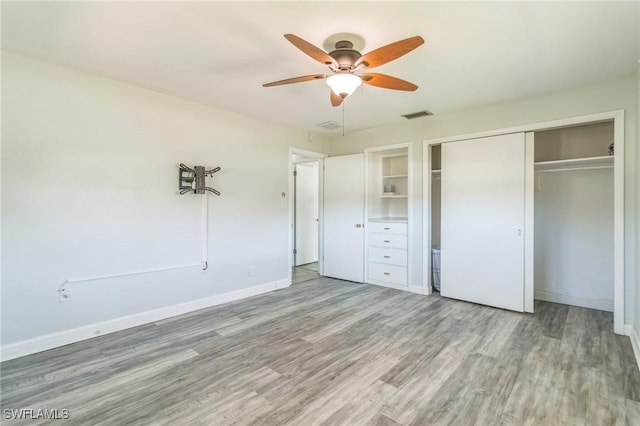 4330 S Canal Cir, North Fort Myers, FL 33903 - unfurnished bedroom featuring a closet, light wood-style floors, baseboards, and a ceiling fan