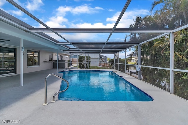 4330 S Canal Cir, North Fort Myers, FL 33903 - swimming pool with a patio and glass enclosure