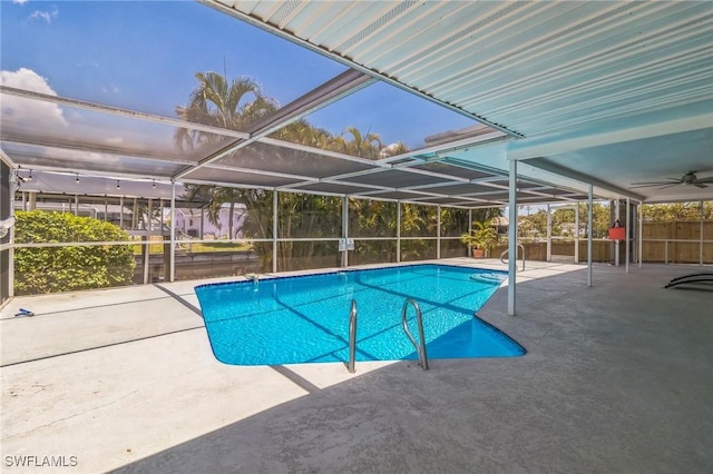 4330 S Canal Cir, North Fort Myers, FL 33903 - swimming pool featuring a patio and glass enclosure